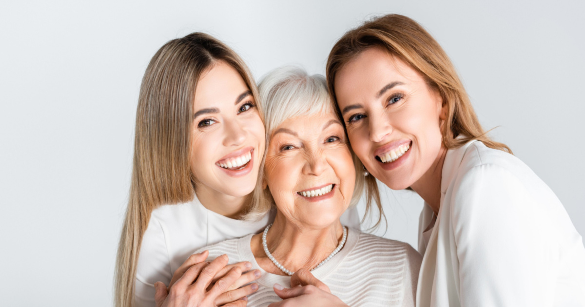 Elderly mom with adult daughters talking about long-term home care
