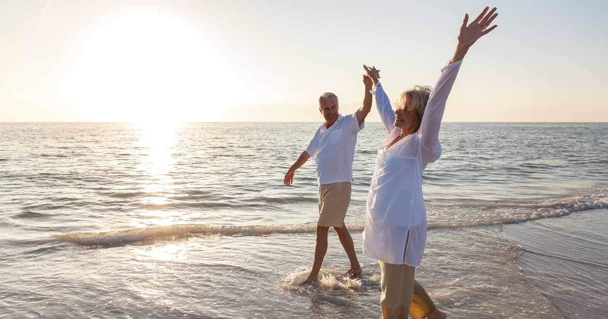 elderly couple in the ocean