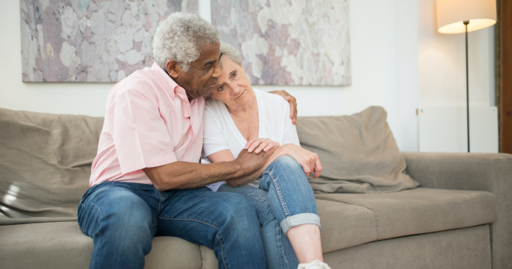 Elderly couple on couch considering in home care