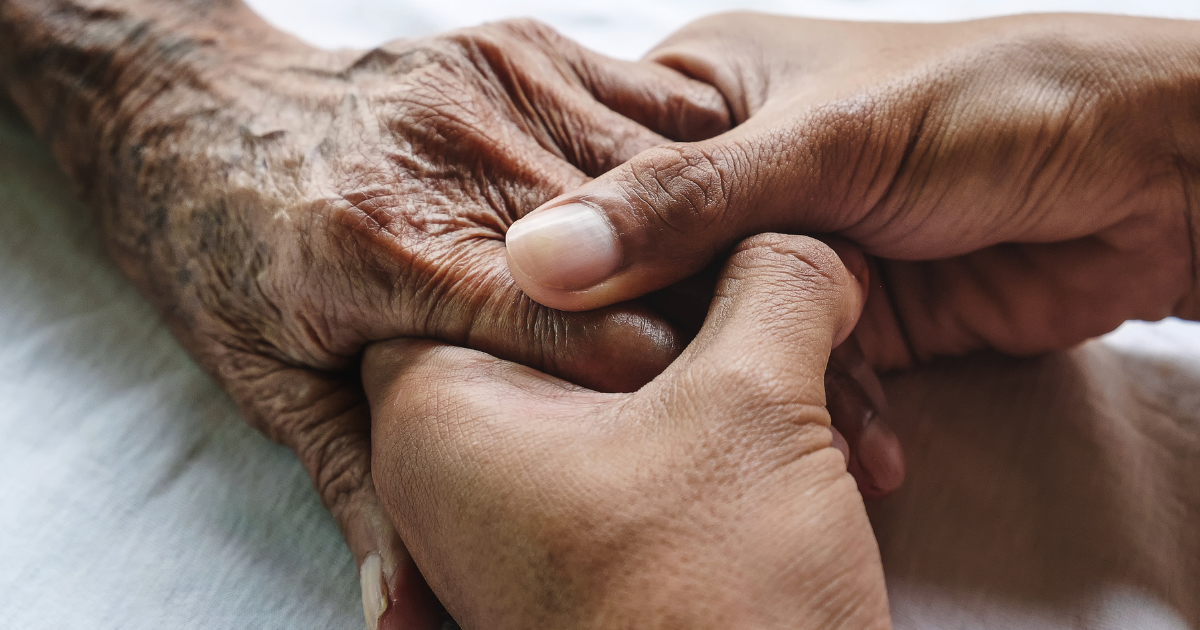 elderly holding hands while learning the link between antidepressants and dementia